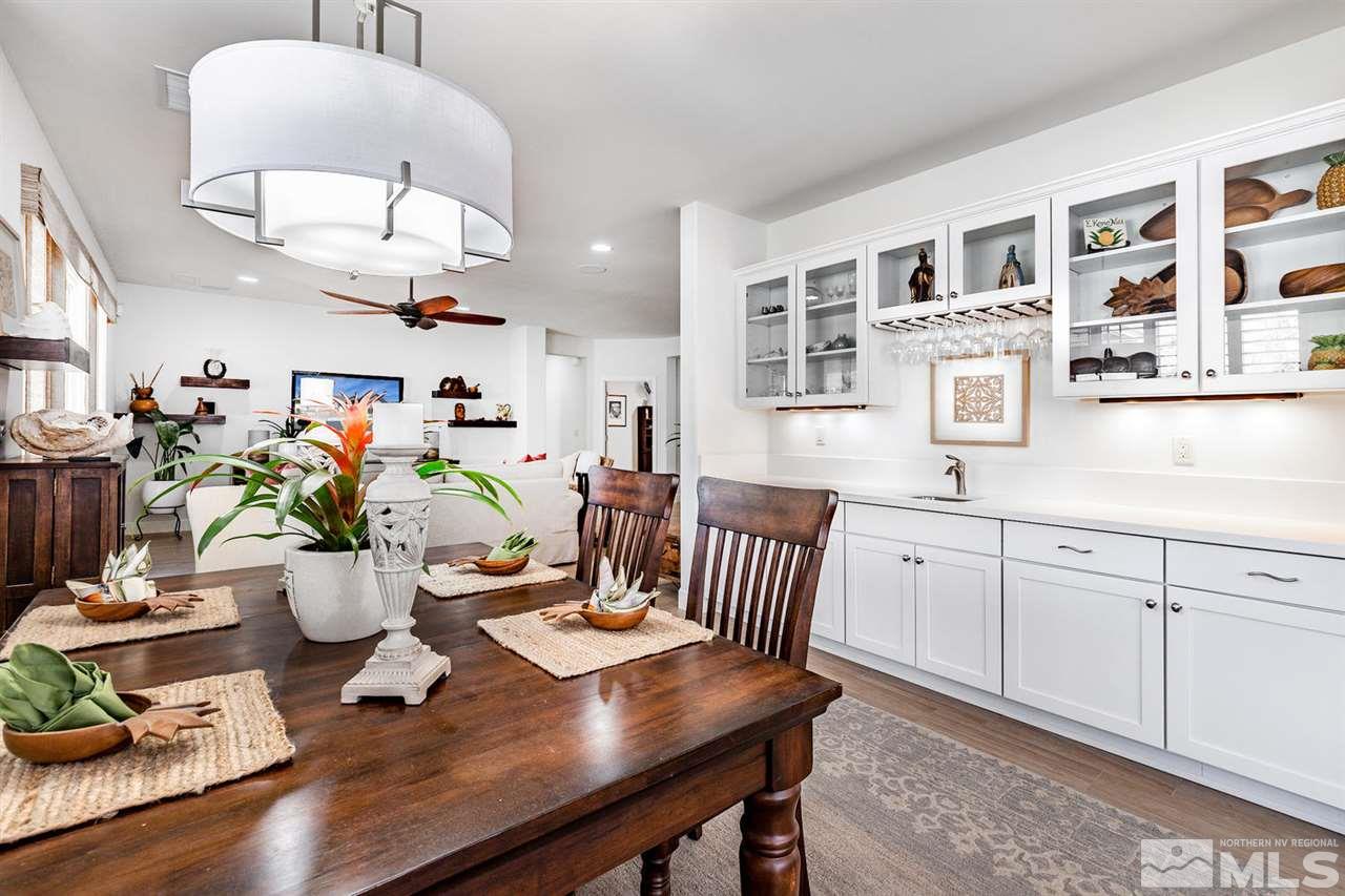 9645 Abigail Way Reno, NV 89521 - Photo 8 of 25 a kitchen with a dining table chairs and living room
