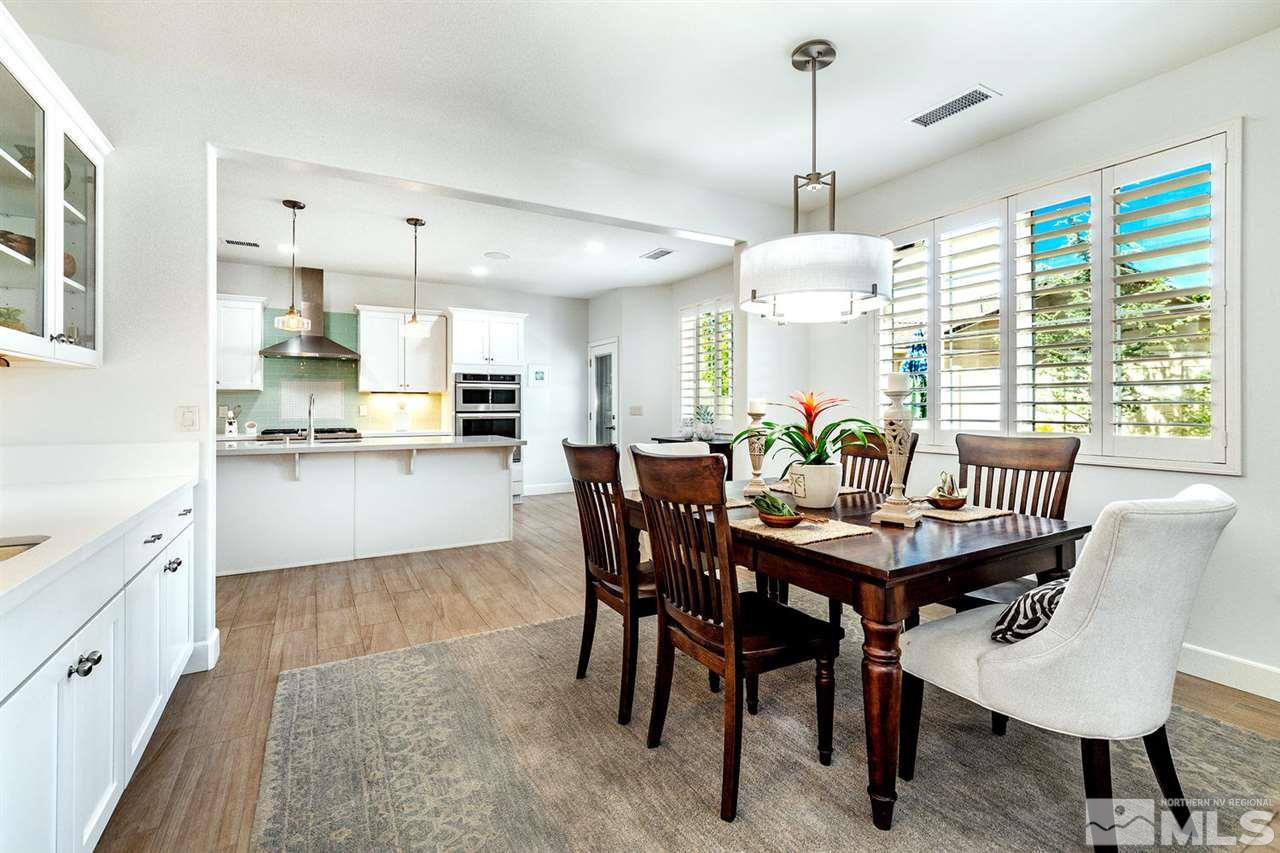 9645 Abigail Way Reno, NV 89521 - Photo 9 of 25 a view of a dining room with furniture window and wooden floor