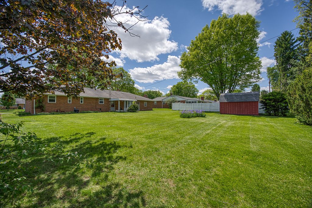 324 Beckenham Road Englewood, OH 45322 - Photo 20 of 26 This expansive backyard offers ample green space and a quaint shed for storage.