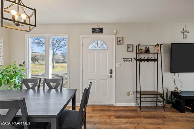 a kitchen with stainless steel appliances granite countertop a stove and a wooden floors