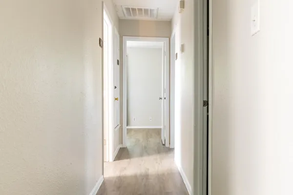 a view of a bathroom from a hallway