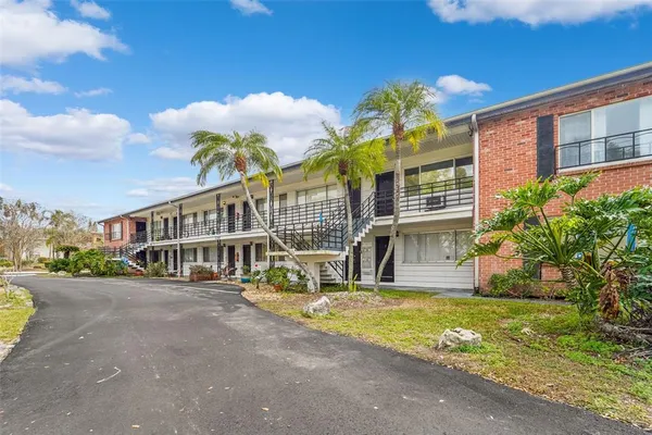 a view of a building with a garden