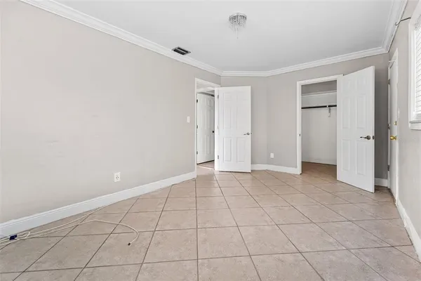 a view of an empty room with a window