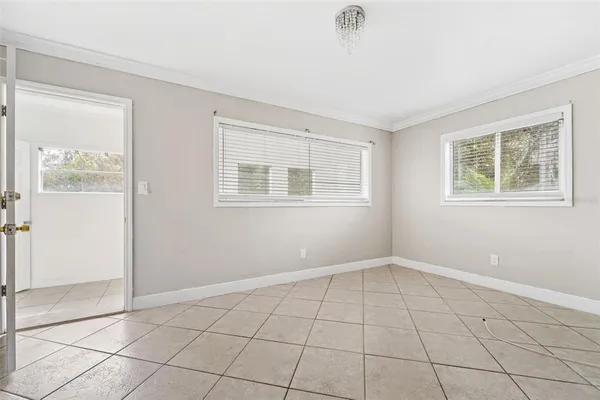 a view of an empty room with a window