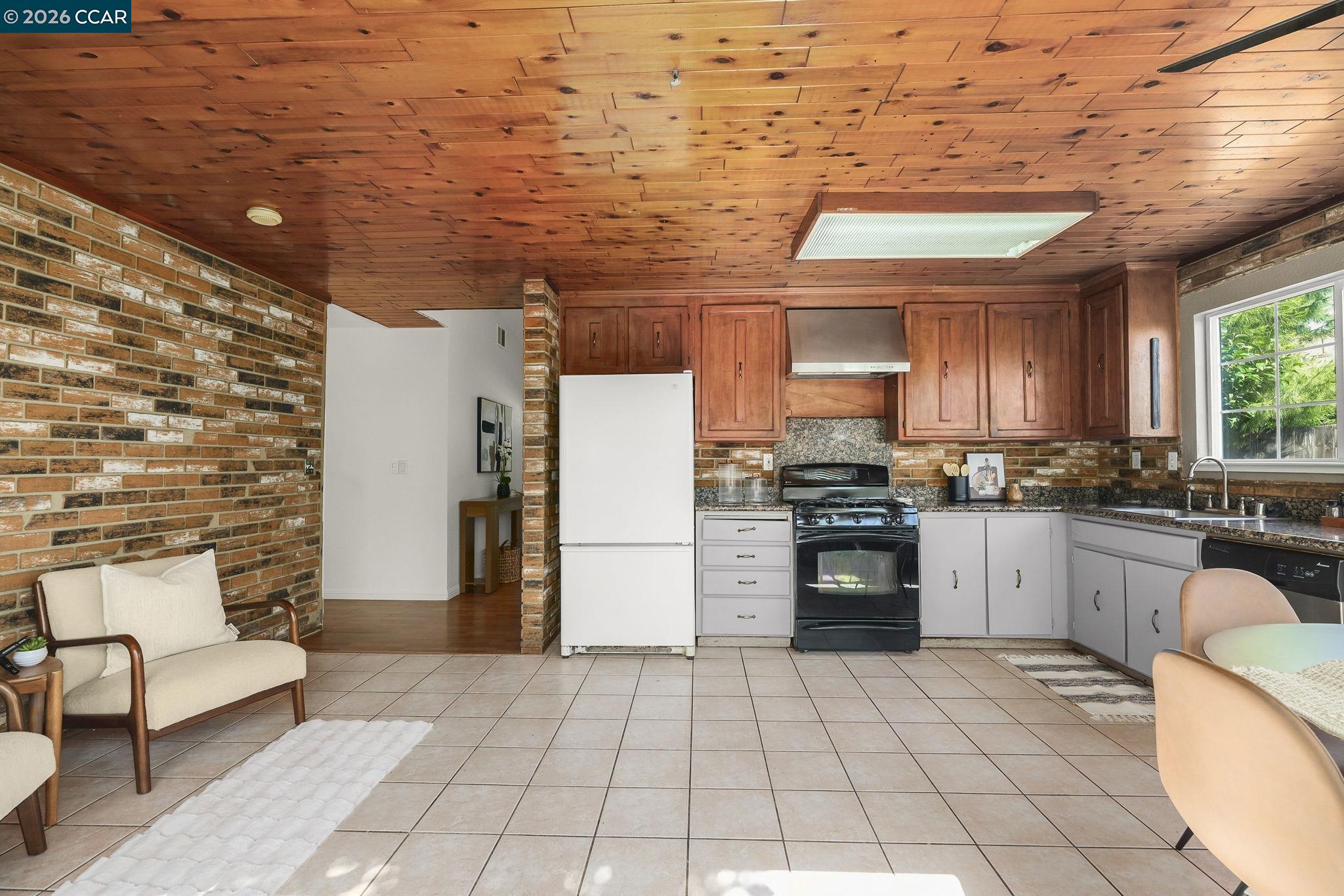 476 Pamela Drive Bay Point, CA 94565 - Photo 3 of 24 a kitchen with stainless steel appliances granite countertop a stove a sink and a refrigerator