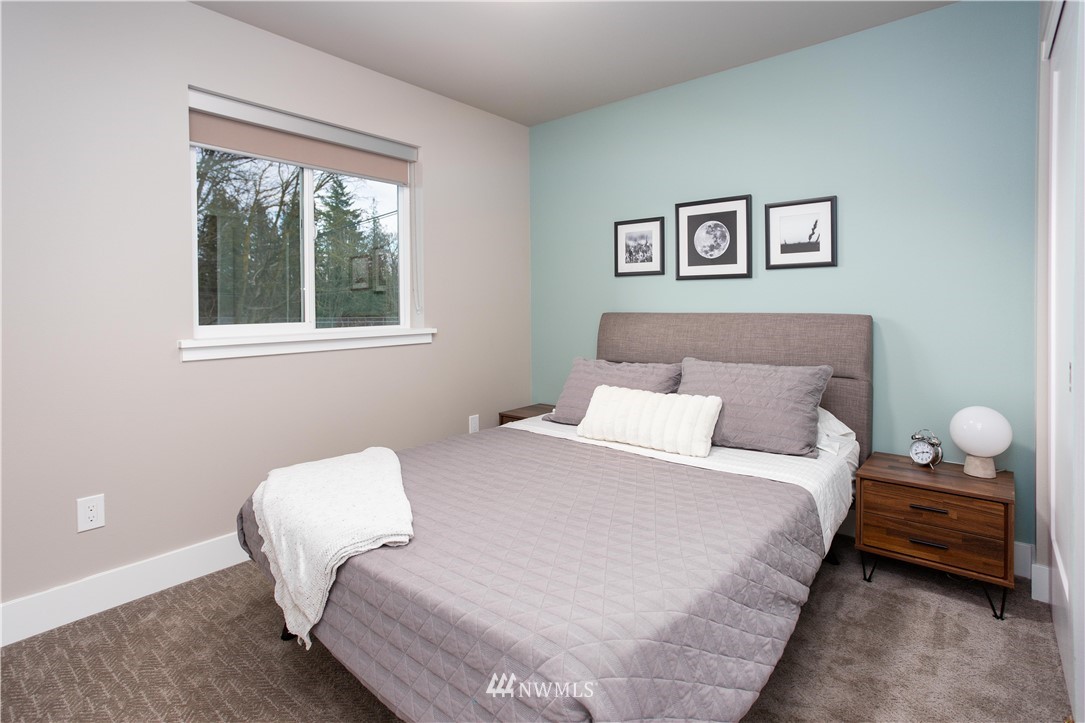 1882 Front Street, Unit 211 Lynden, WA 98264 - Photo 10 of 20 a bedroom with a bed and a window