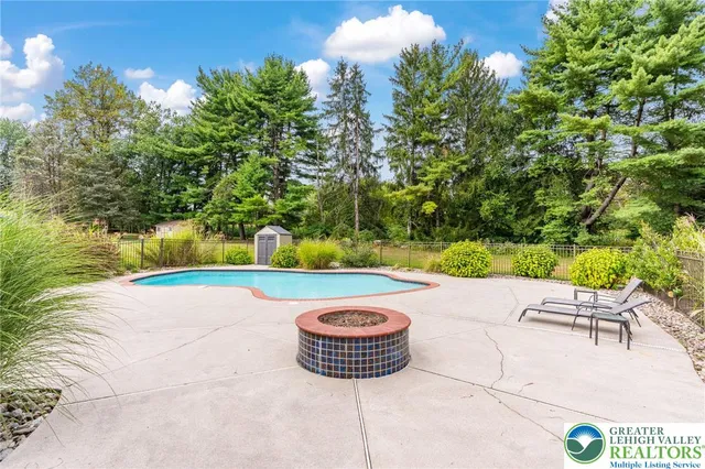 a view of swimming pool with a yard