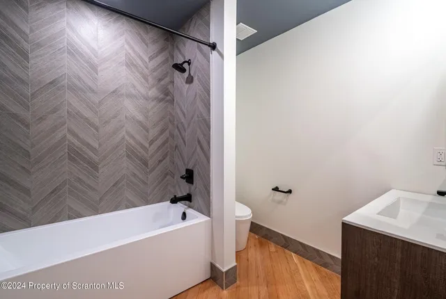 a kitchen with a sink stove and microwave