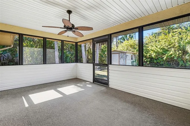 a view of an empty room with a balcony