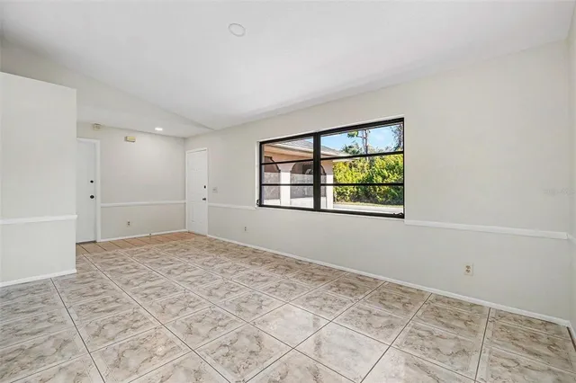 a view of an empty room and window