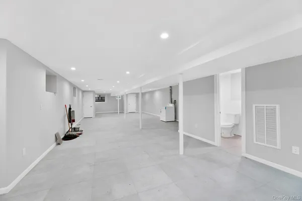 a view of room with stairs and a window