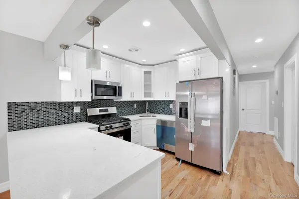 a kitchen with a refrigerator a sink and dishwasher