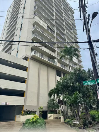 a front view of a building with street view