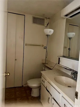 a bathroom with a toilet sink and shower
