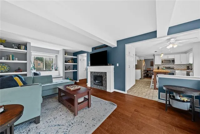 a living room with furniture and a fireplace