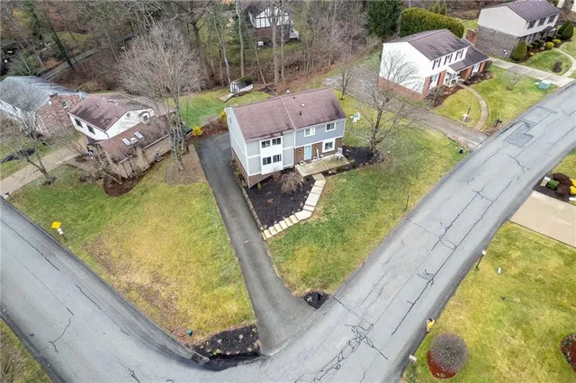 a view of a pool with chairs