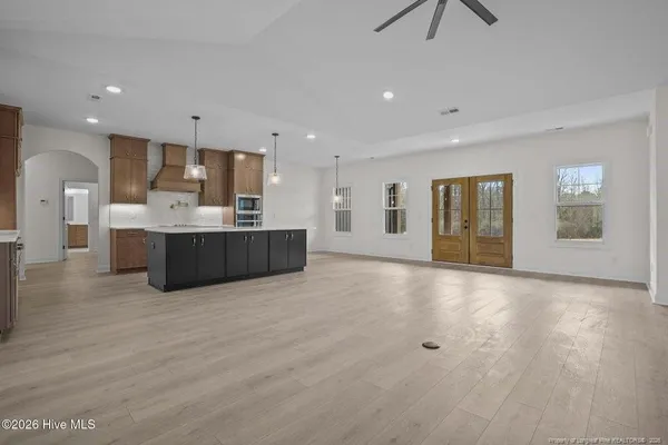 a view of kitchen and kitchen with furniture and wooden floor