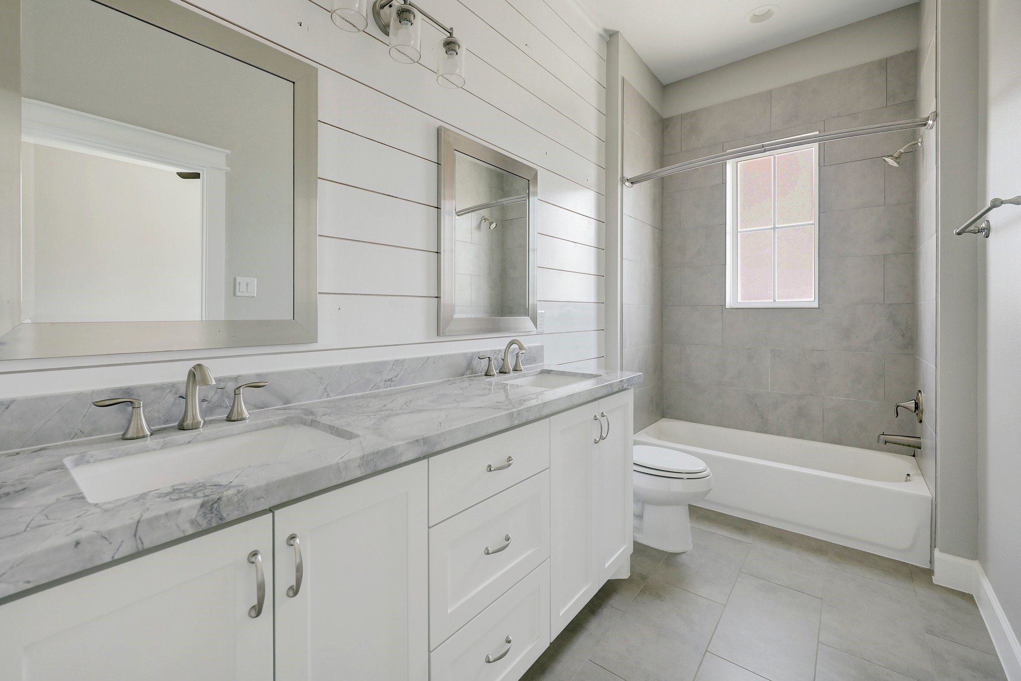5233 Larkin Street, Unit A Houston, TX 77007 - Photo 14 of 15 a bathroom with a granite countertop sink a toilet and bathtub