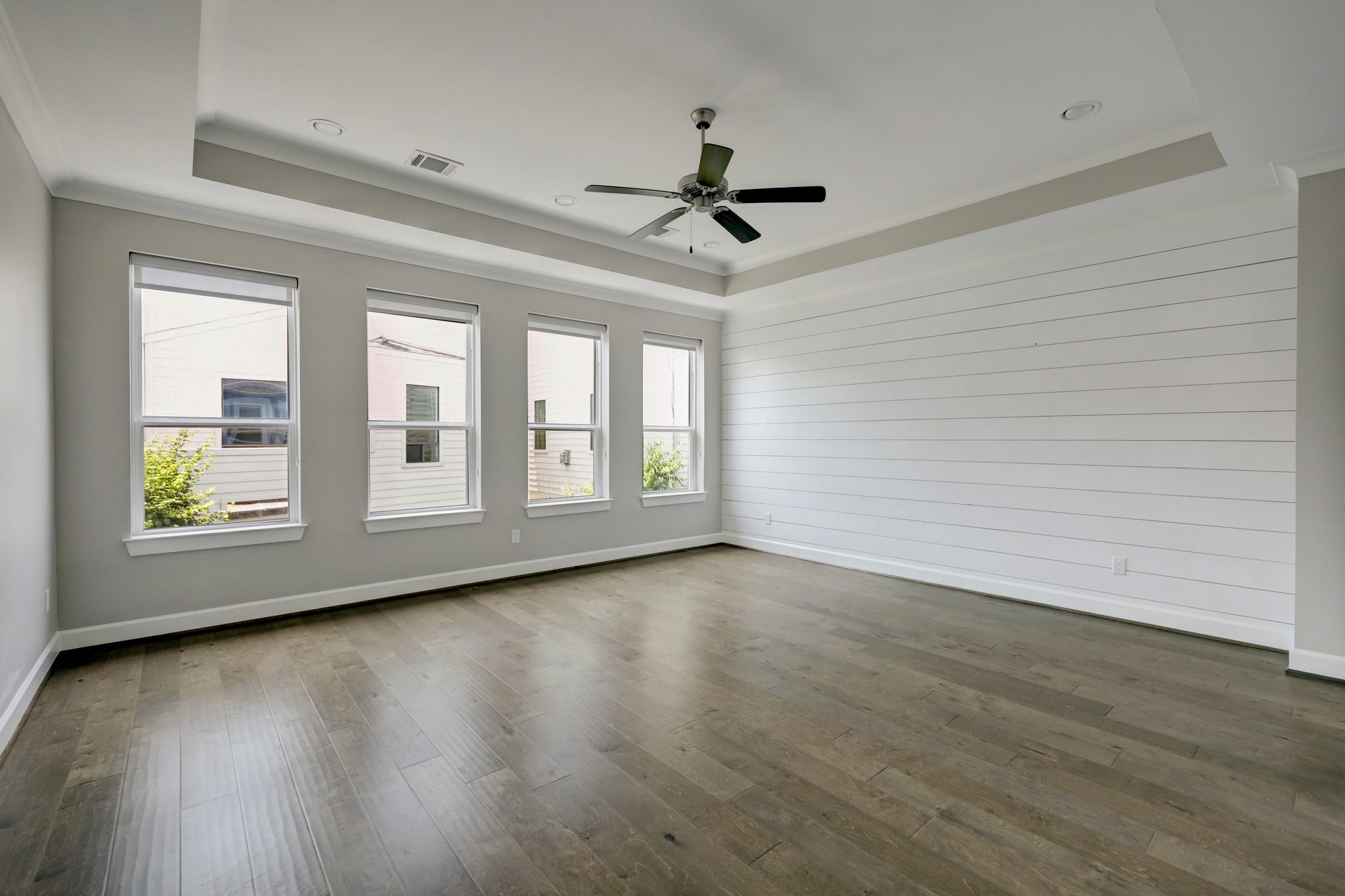 5233 Larkin Street, Unit A Houston, TX 77007 - Photo 6 of 15 a view of an empty room with wooden floor and a window
