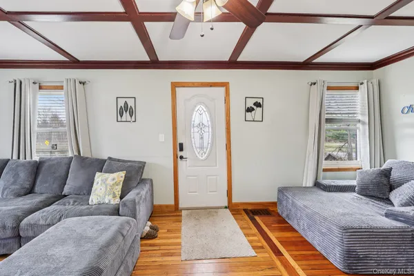 a living room with furniture and a rug