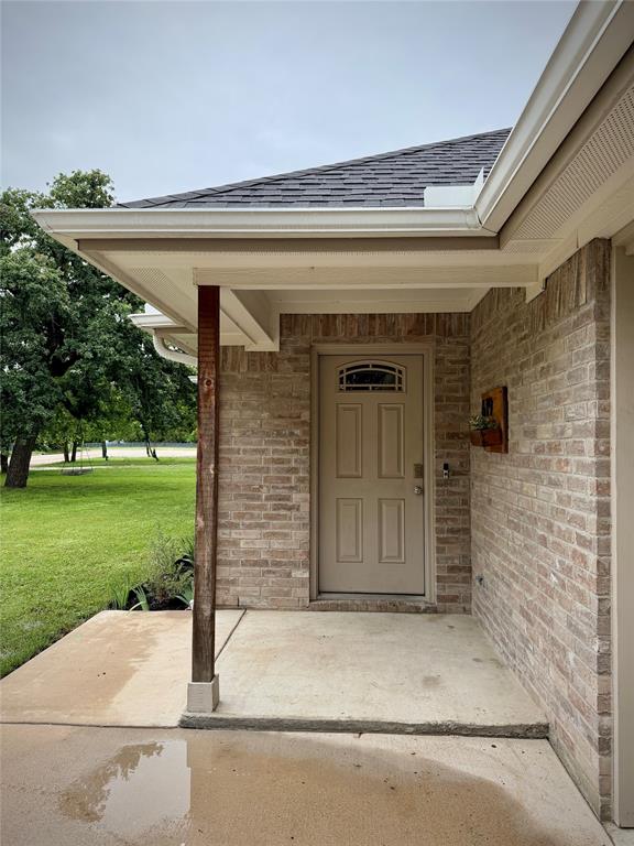 619 Mansfield Road Cleburne, TX 76031 - Photo 15 of 19 Brick exterior with a covered entry