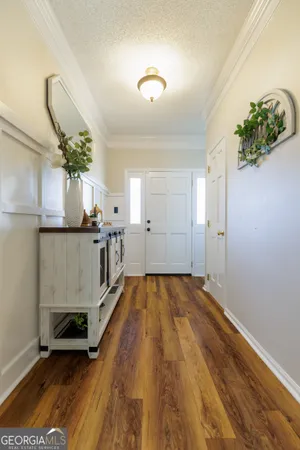a living room with furniture and flowers
