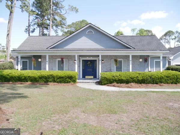 a front view of a house with garden