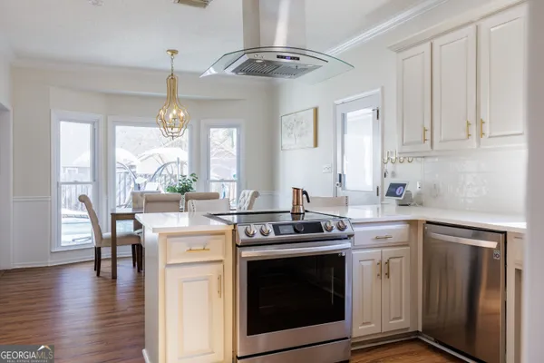 a bedroom with a bed and a ceiling fan with wooden floor