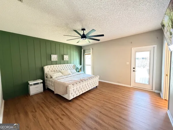 a bed room with a bed and a night stand