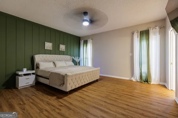 a bedroom with a bed and closet