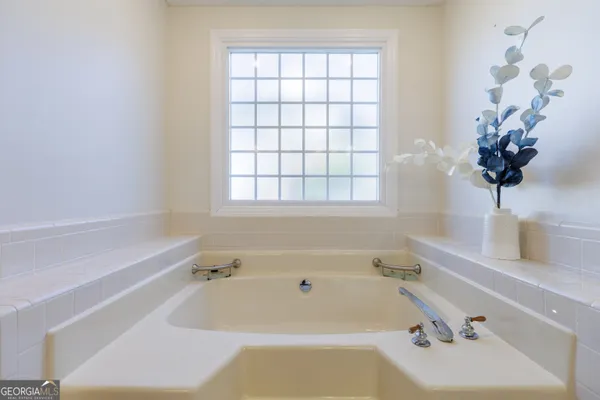 a bedroom with two beds and painted walls