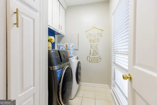 a view of a patio with table and chairs