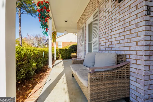 a living room with fireplace furniture and a wooden floor