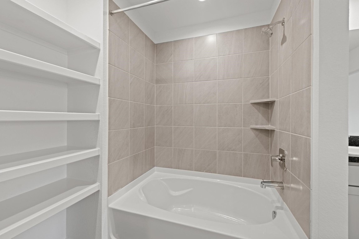 5710 Sycamore Glen Dr Spring Spring, TX 77373 - Photo 13 of 18 a close up of a bathtub in a bathroom