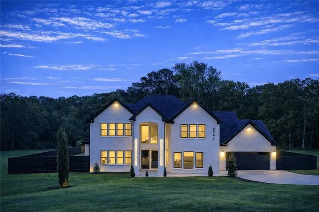 a front view of a house with a yard