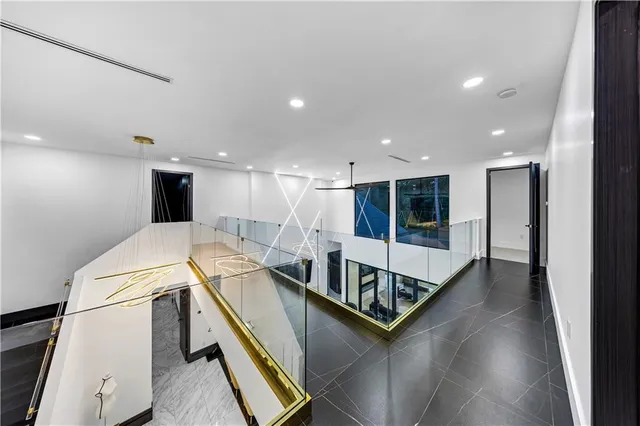 a bathroom with a sink vanity mirror and toilet