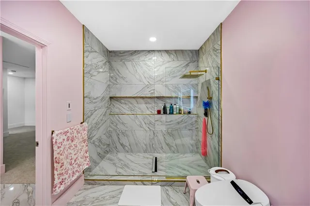 a living room with furniture a ceiling fan a rug and a window