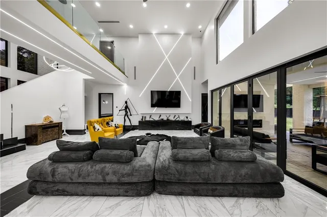 a living room with furniture and a flat screen tv