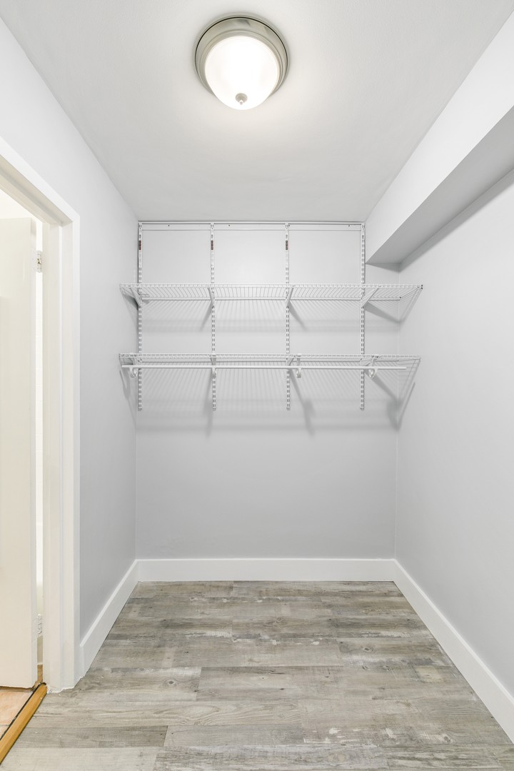 5858 North Sheridan Road, Unit 805 Chicago, IL 60660 - Photo 7 of 14 a view of a room with racks on the wall