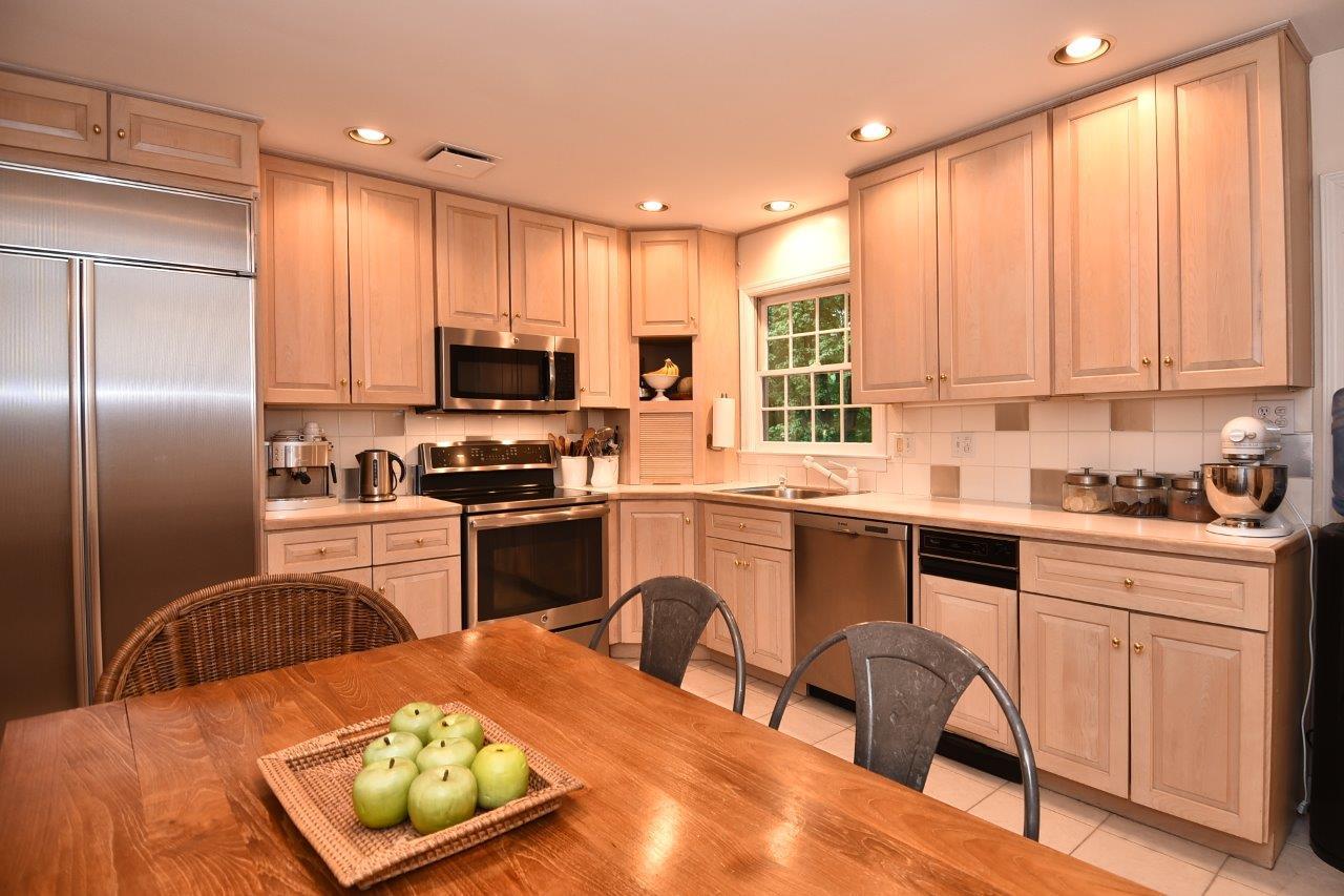 287 Briscoe Road New Canaan, CT 06840 - Photo 13 of 22 a kitchen with a refrigerator stove top oven and sink