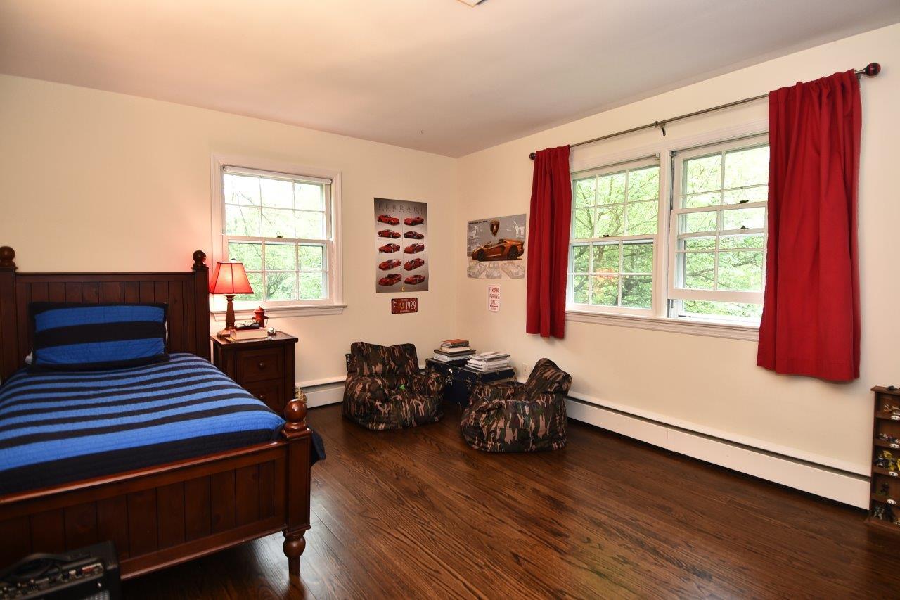 287 Briscoe Road New Canaan, CT 06840 - Photo 19 of 22 a bedroom with furniture and wooden floor