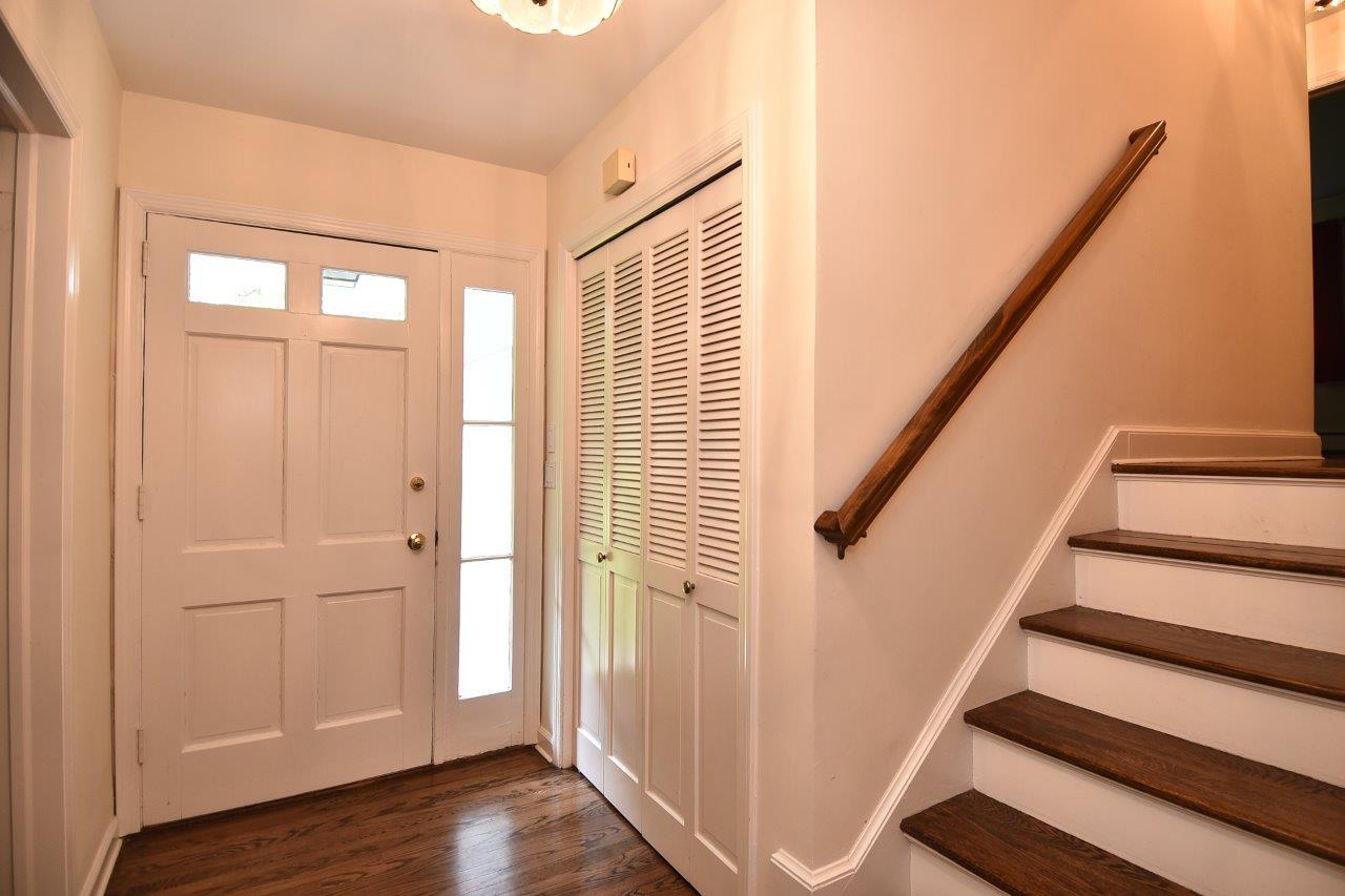 287 Briscoe Road New Canaan, CT 06840 - Photo 3 of 22 a view of entryway with wooden floor and stairs