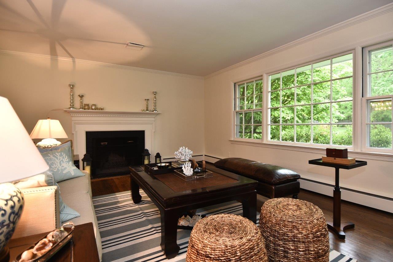 287 Briscoe Road New Canaan, CT 06840 - Photo 5 of 22 a living room with furniture and a fireplace