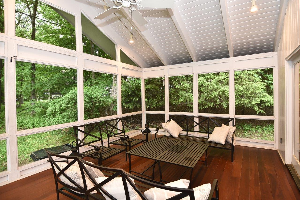 287 Briscoe Road New Canaan, CT 06840 - Photo 10 of 22 a view of a chairs and table in the balcony