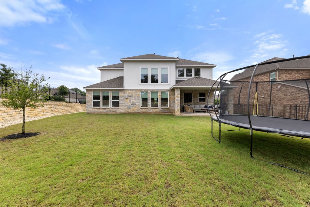 365 Pear Tree Lane Austin, TX 78737 - Photo 39 of 39 a view of a house with a swimming pool