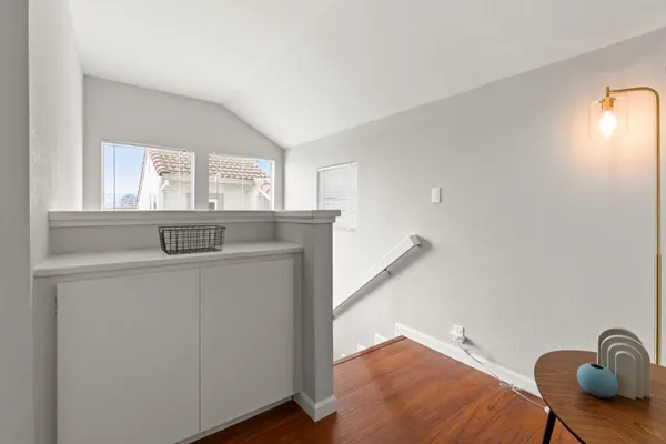a utility room with cabinets and a window