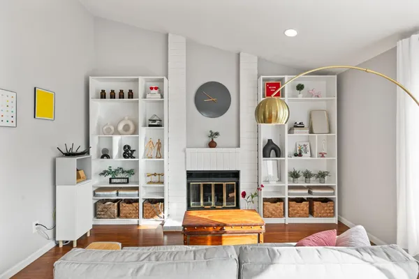 a living room with furniture and a fireplace