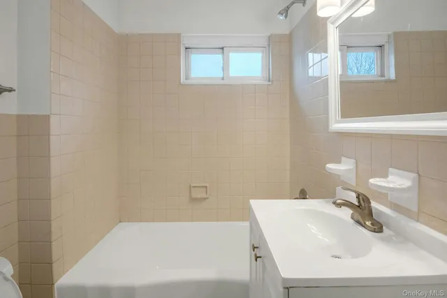 a bathroom with a sink and a bathtub