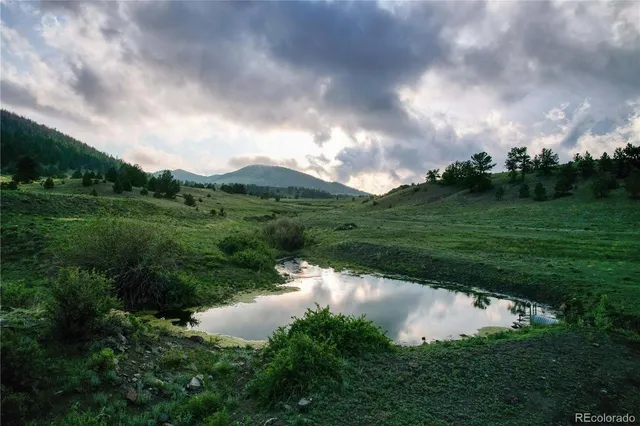 a view of a lake with a big yard
