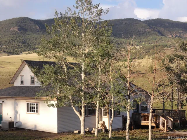 a view of multiple houses with a road